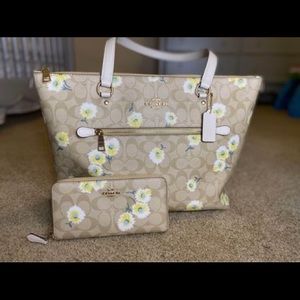 Coach Daisy print handbag and matching wallet.